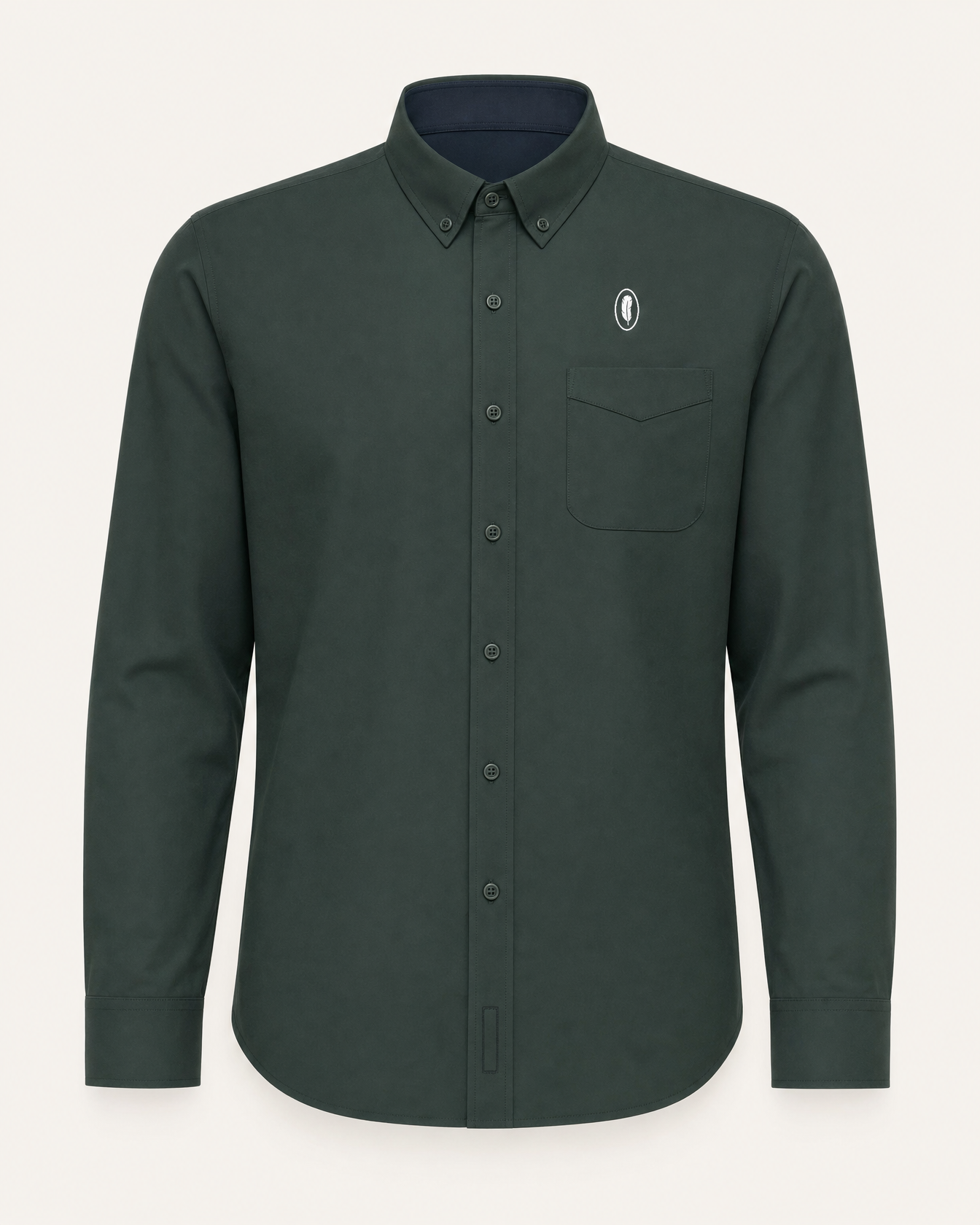 The Laurel — dark green embroidered long-sleeve shirt with feather crest