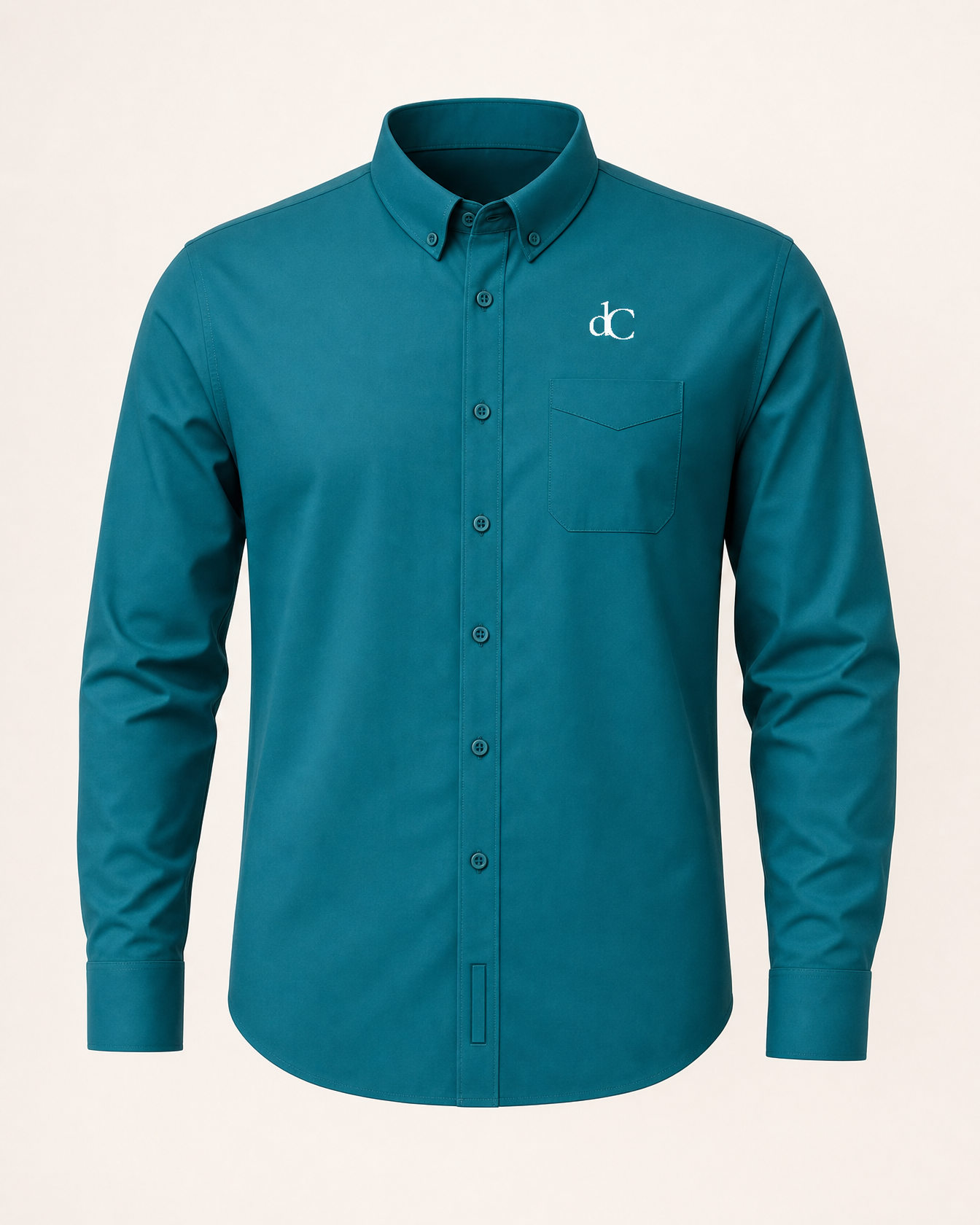 The Peacock — teal green embroidered long-sleeve shirt with dC monogram
